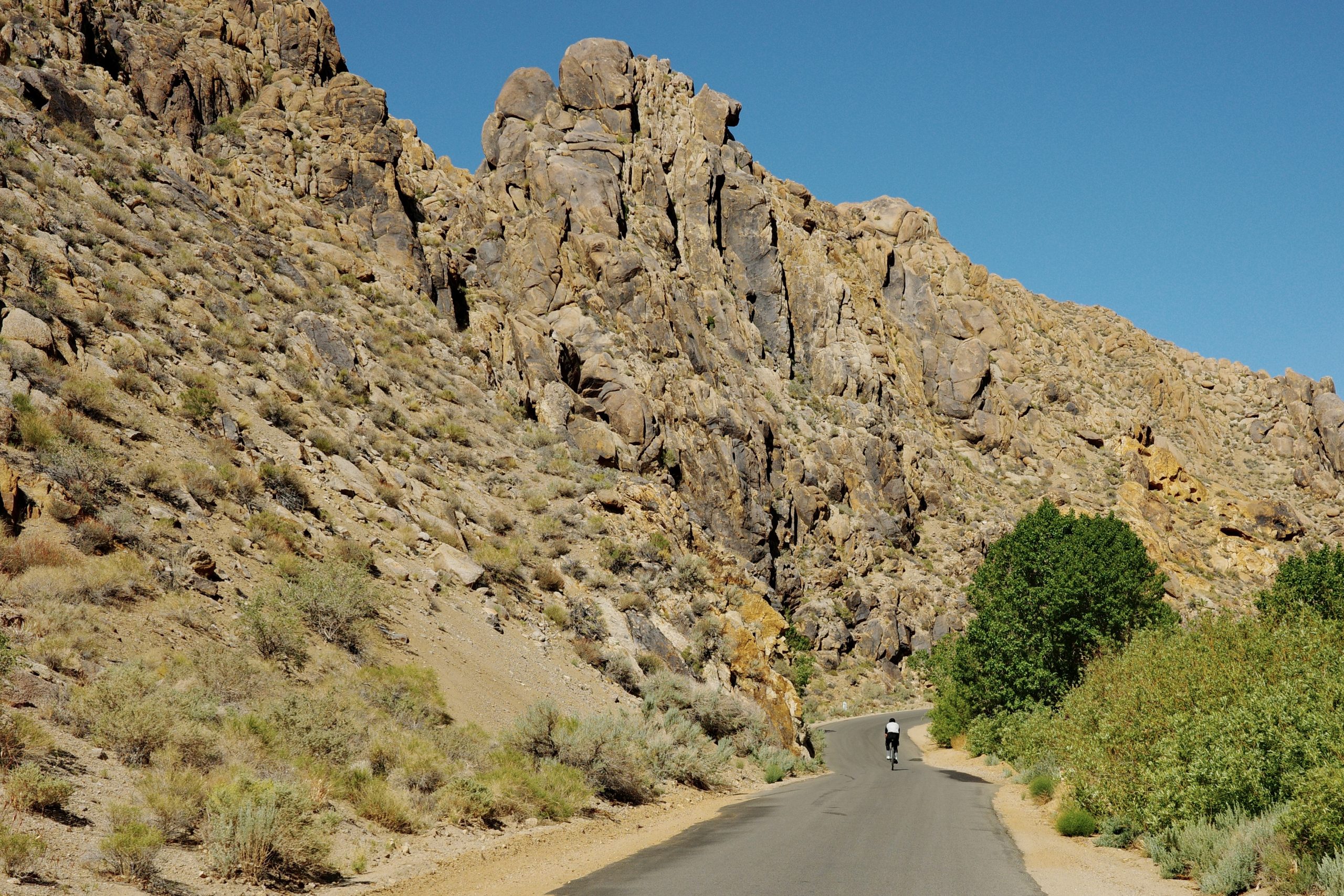 Bicycle on road with rock formation in background