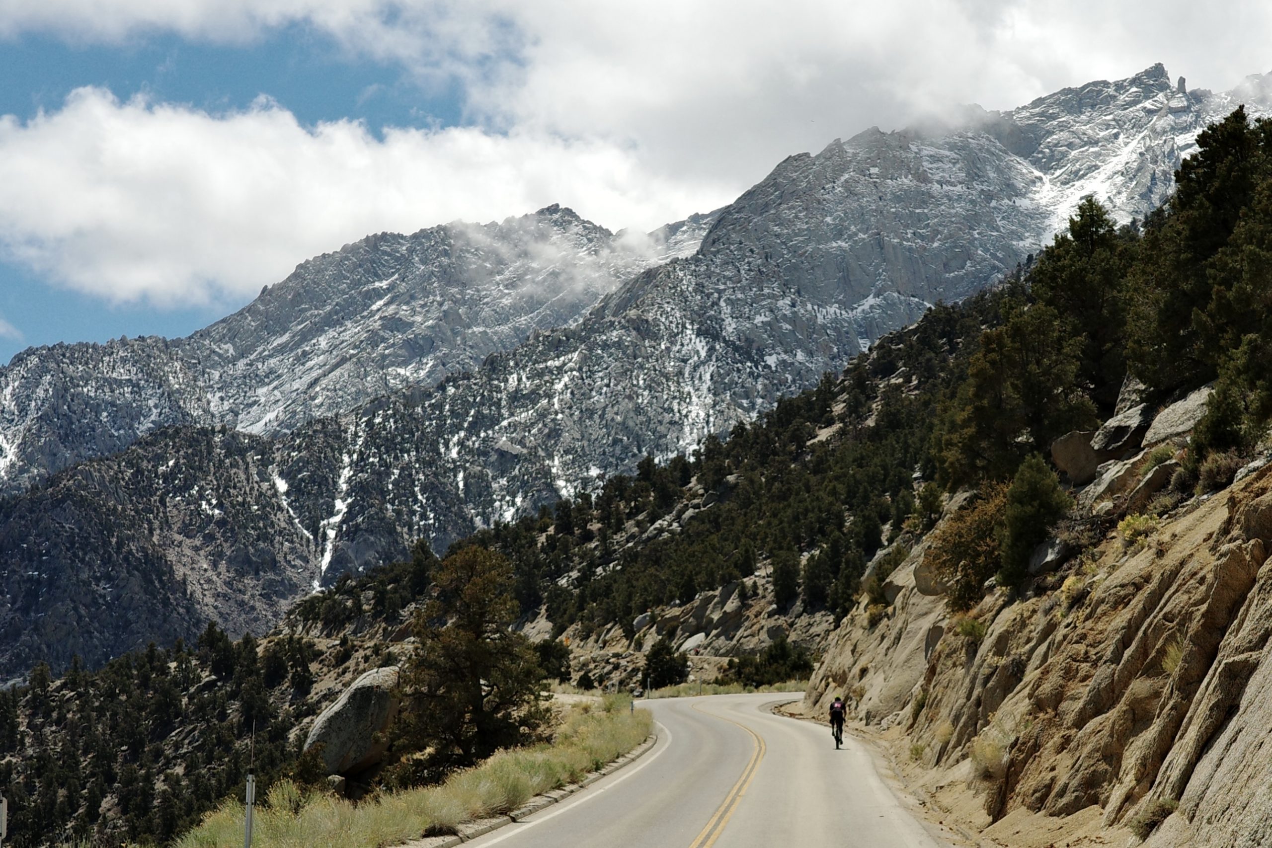 Bicycle on road with large snowy mountain in the background